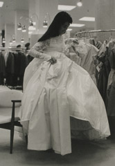 Ruth-Marion Baruch  -  Filipino Bride Choosing Wedding Dress From Rack of Clothes, 1961 / Silver Gelatin Print  -  11 x 14