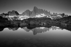 Peter Essick  -  Reflection of the Minarets in small pond near Cecile Lake. / Pigment Print  -  available in multiple sizes