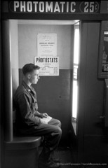 Harold Feinstein  -  GI in Photo Booth, Camp Kilmer, 1952 /   -  