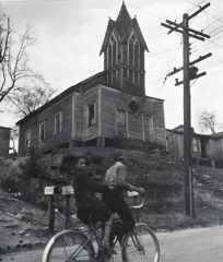 John Gutmann  -  Bicycling by the Old Village Church, Georgia, 1937 /   -  11 x 14