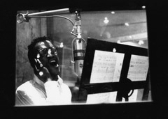 Herb Snitzer  -  Sammy Davis Jr. singing “No Greater Love” with the Basie Band at a NYC recording studio, 1960 / Silver Gelatin Print  -  11 x 14