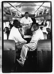 Herb Snitzer  -  On the Duke Ellington bus: saxophone players Cat Anderson (left) and Johnny Hodges (right) playing cards, NYC, 1961 / Silver Gelatin Print  -  11 x 14