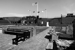 Tim Barnwell  -  2313, Fort Moultrie inside courtyard, benches left, flags top center, Charleston, SC /   -  