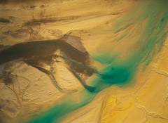 Robert Glenn Ketchum  -  Meltwater Flowing Over Golden Sand and Silt Bars, 1994 / Chromogenic Print  -  30 x 40