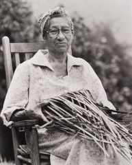 Tim Barnwell  -  Eva Wolfe, Seated, Making Double Weave Basket, Cherokee, Swain County, NC, 1991 / Silver Gelatin Print  -  11 x 14