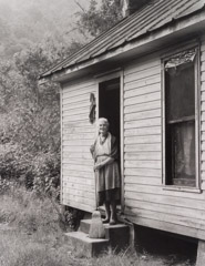 Tim Barnwell  -  Laura Cook Cleaning House, Gahagan Farm, Belva, Madison County, NC, 1981 / Silver Gelatin Print  -  11 x 14