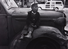 Ruth-Marion Baruch  -  Boy on Car, San Francisco, 1953 / Silver Gelatin Print  -  9 x 12