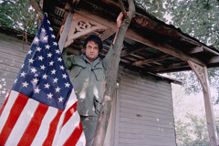 Al Clayton  -  Johnny Cash (flag/porch) / Pigment Print  -  Available in Multiple Sizes