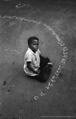 Harold Feinstein  -  Boy With Chalk Numbers, 1955 / Silver Gelatin Print  -  11 x 14 (period/vintage print)
