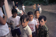 Vivian Maier  -  North Shore Chicago, July 1967,  (young boys) / Chromogenic Print  -  10 x 15 on 16 x20 paper