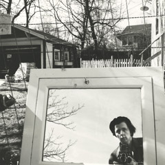   -  Self-Portrait, 1961 (in mirror lr outside) / Silver Gelatin Print  -  12 x 12 (on 16x20 paper)