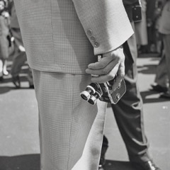 Vivian Maier  -  New York, NY 1955 (movie camera) / Silver Gelatin Print  -  12 x 12 (on 16x20 paper)