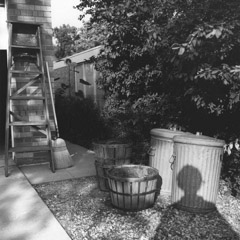 Vivian Maier  -  Self Portrait, Chicagoland, 1966, (shadow trashcan) / Silver Gelatin Print  -  12 x 12 (on 16x20 paper)