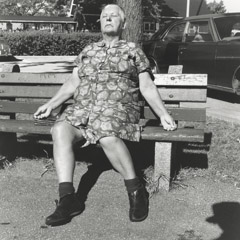 Vivian Maier  -  Self-Portrait, 1974 (woman on bench) / Silver Gelatin Print  -  12 x 12 (on 16x20 paper)