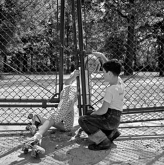 Vivian Maier  -  Chicago, 1962 (kids fence) / Silver Gelatin Print  -  12 x 12 on 16 x20 paper