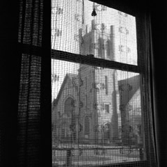 Vivian Maier  -  undated, NY NY, (church through curtains) / Silver Gelatin Print  -  12 x 12