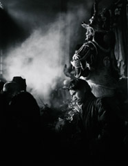 John Gutmann  -  Beneath a Giant Guardian the Fortune Teller, Yunnan Province, China / Silver Gelatin Print  -  11x14