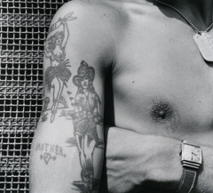 John Gutmann  -  Girlie Tattoos, Wristwatch and Dog Tag. 1945 /   -  11x14