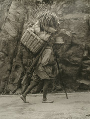 Dorothea Lange  -  Man Carrying Loaded  Basket, Asia, 1957 / Silver Gelatin Print  -  13.5 x 10.25
