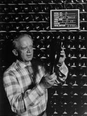 Ansel Adams  -  Winemaker examining wine bottle / Silver Gelatin Print  -  12.75 x 9.68 (20x16 mat)