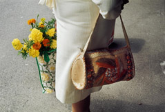 Vivian Maier  -  August 1975, (handbag/flowers) / Chromogenic Print  -  10 x 15 (on 16x20 paper)