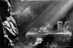 Harold Feinstein  -  Man Smoking in Diner, 1950 / Silver Gelatin Print  -  30 x 40