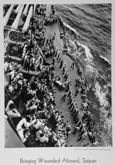 Uncredited Military Photographer  -  Bringing Wounded Aboard, Saipan / Silver Gelatin Print  -  11 x 14