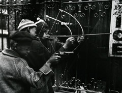 John Gutmann  -  The Sharpshooters. Harlem, NYC, 1936 / Silver Gelatin Print  -  11x14