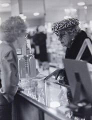 Ruth-Marion Baruch  -  Old Lady w/Cherry Hat & Salesgirl, San Francisco, 1961 / Silver Gelatin Print  -  