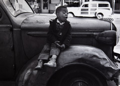 Ruth-Marion Baruch  -  Boy On Car, San Francisco, 1953 / Silver Gelatin Print  -  